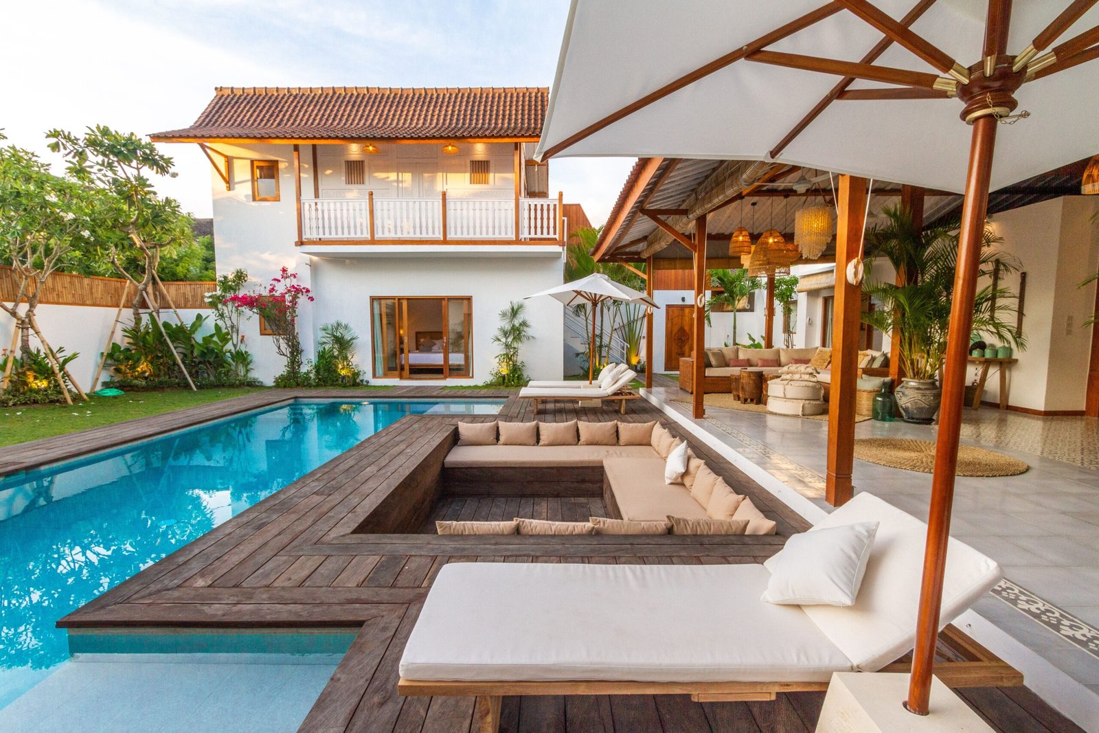 A Mediterranean villa with poolside loungers and shaded terraces